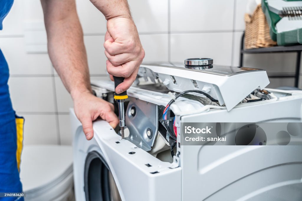 AC technician servicing an air conditioner